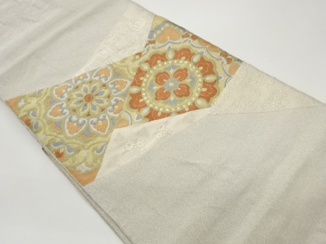 切り嵌め風華文に動物模様織出し名古屋帯